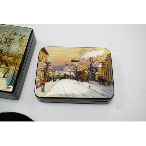 571 - Three late 19th/early 20th century Russian lacquer boxes, decorated with snow scenes, largest 13.5cm... 