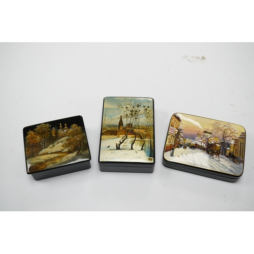 571 - Three late 19th/early 20th century Russian lacquer boxes, decorated with snow scenes, largest 13.5cm... 