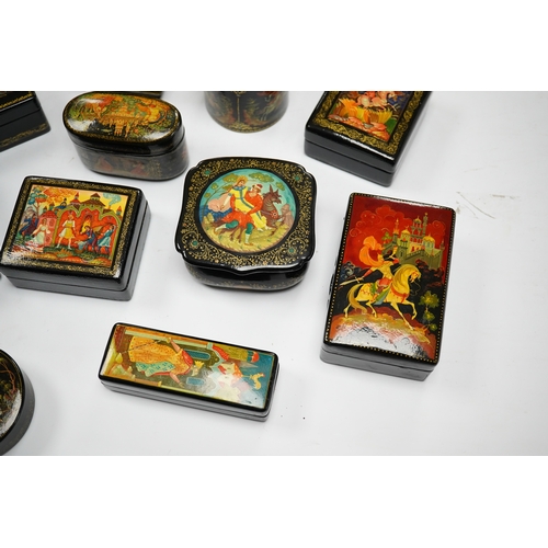 577 - A quantity of Russian lacquer boxes decorated with figures and mythical scenes, largest 10cm in leng... 