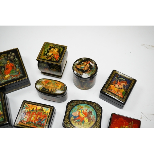 577 - A quantity of Russian lacquer boxes decorated with figures and mythical scenes, largest 10cm in leng... 