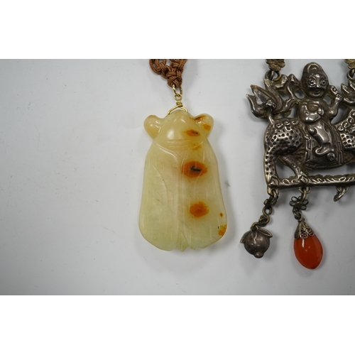 589 - A Chinese celadon and russet jade cicada pendant on cording and a silver and stone mounted chain and... 