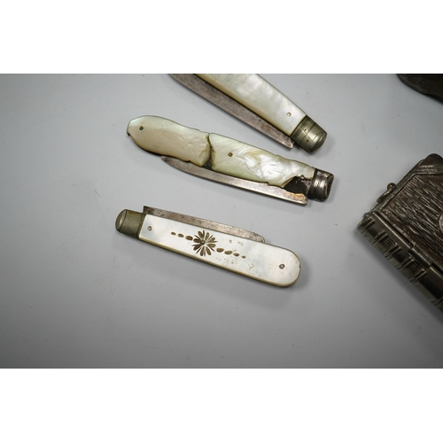 595 - Four mother-of-pearl penknives, two vesta cases and a treen shoe, treen shoe 10cm long. Condition - ... 