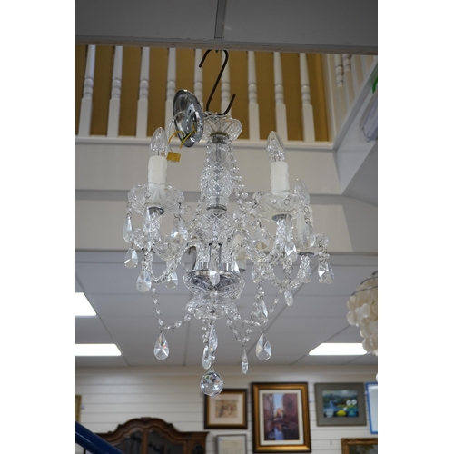 604 - A pair of five branch cut glass chandeliers, approximately 55cm high. Condition - good