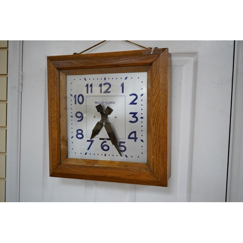 605 - An early 20th century French Art Deco Bulle Electrique oak wall clock, 39cm squared. Condition - scr... 