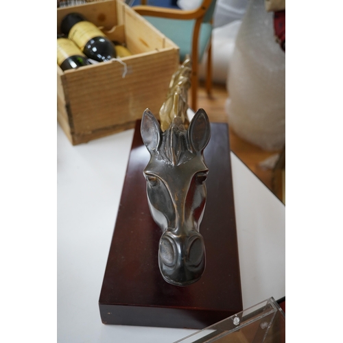 607 - A French Art Deco patinated brass model of a horses head, unsigned, 60cm wide. Condition - fair to g... 