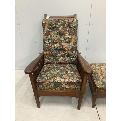 61 - An early 20th century Morris style beech reclining armchair with a matching footstool, width 78cm, d... 