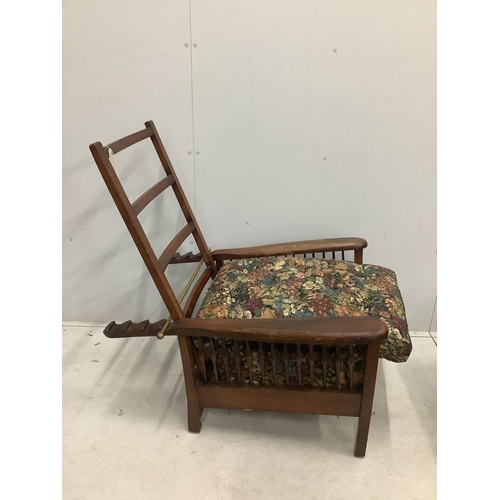 61 - An early 20th century Morris style beech reclining armchair with a matching footstool, width 78cm, d... 