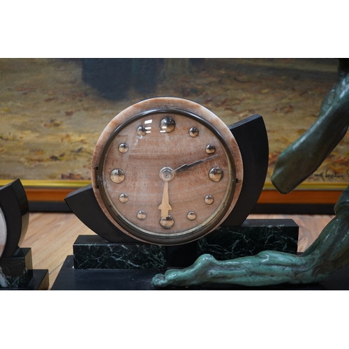 610 - A French Art Deco spelter and marble archer clock garniture, 60.5cm wide, 51.5cm high. Condition -... 