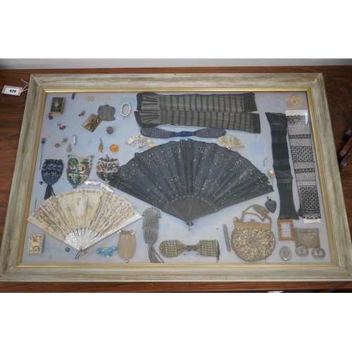 629 - A framed display montage of late 18th and 19th century decorative ladies sequin and lace fans, beadw... 