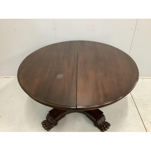 66 - A George IV style circular mahogany extending dining table, 224cm extended, two spare leaves, width ... 