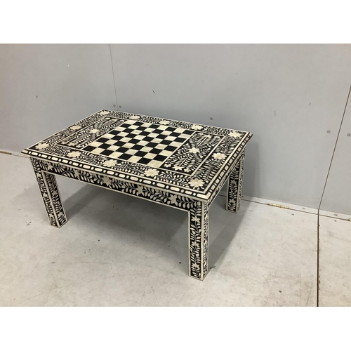 67 - A rectangular faux ivory inlaid low games table, width 92cm, depth 42cm, height 36cm. Condition - fa... 