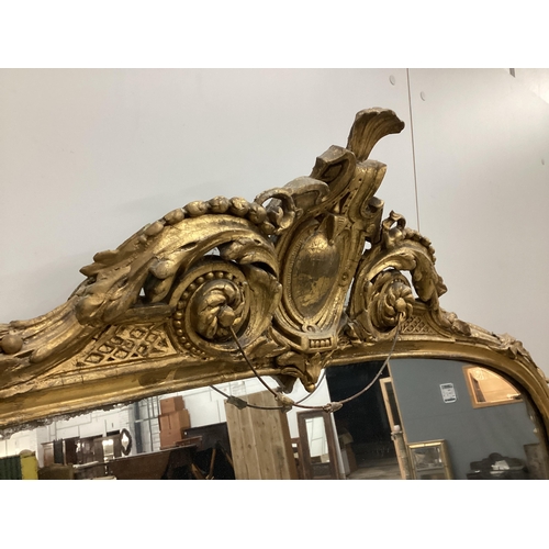 7 - A Victorian giltwood and composition overmantel mirror with cartouche pediment, width 140cm, height ... 