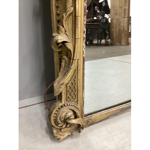 7 - A Victorian giltwood and composition overmantel mirror with cartouche pediment, width 140cm, height ... 