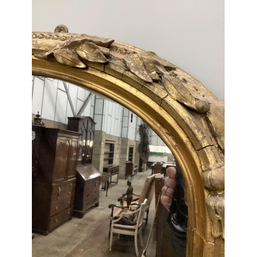 7 - A Victorian giltwood and composition overmantel mirror with cartouche pediment, width 140cm, height ... 