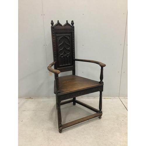 72 - A Continental Gothic Revival oak elbow chair, width 66cm, depth 50cm, height 124cm. Condition - fair... 