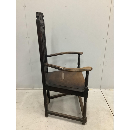 72 - A Continental Gothic Revival oak elbow chair, width 66cm, depth 50cm, height 124cm. Condition - fair... 