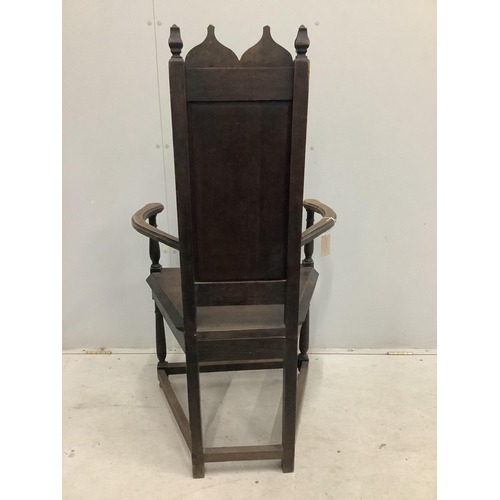 72 - A Continental Gothic Revival oak elbow chair, width 66cm, depth 50cm, height 124cm. Condition - fair... 