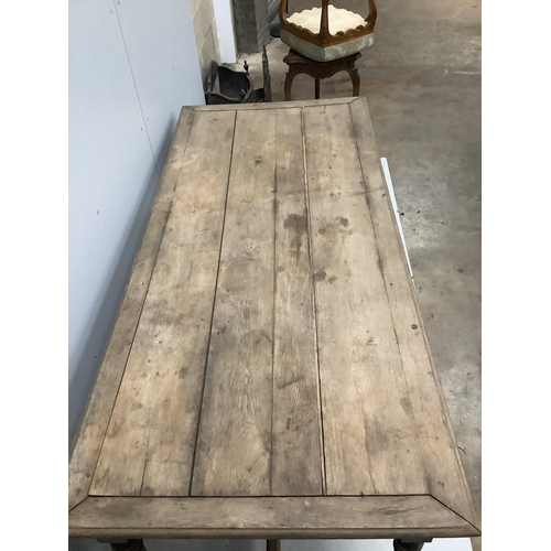 74 - A 19th century French rectangular oak kitchen table, one side drawer and two end drawers, width 199c... 