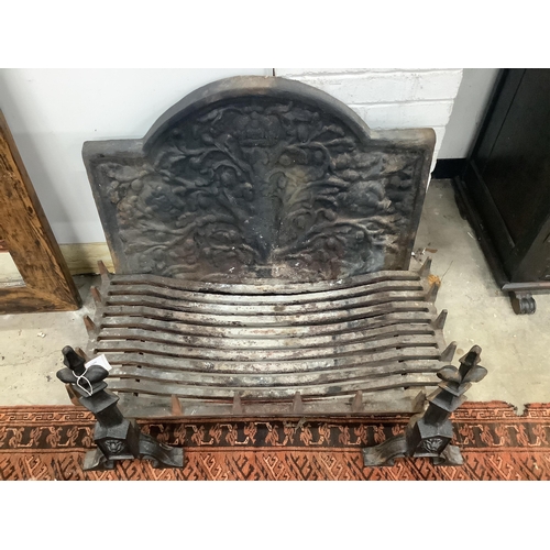 8 - A cast iron fireback together with a fire grate, width 92cm, height 72cm and supporting fire dogs. C... 