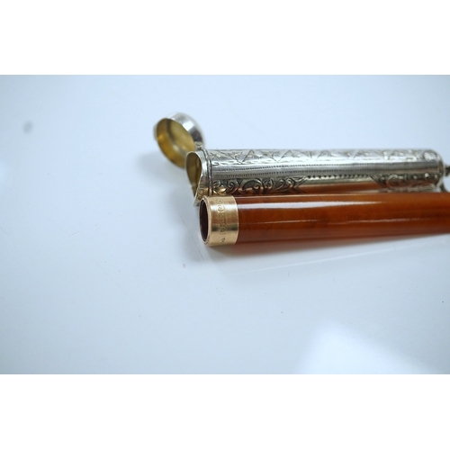 857 - A 9ct gold mounted amber cigarette holder, 78mm, in a silver case. Condition - fair