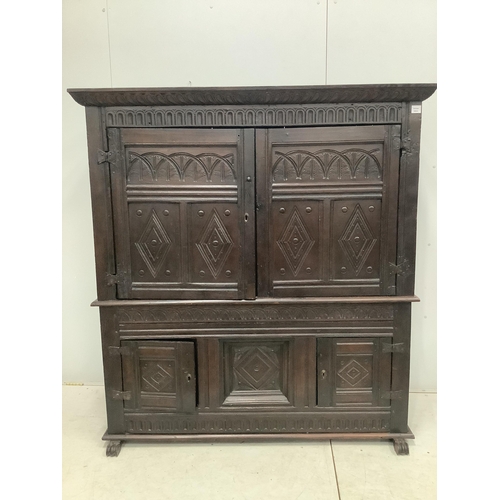 9 - A late 17th century Continental carved oak two section cupboard, width 166cm, depth 57cm, height 167... 