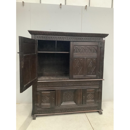 9 - A late 17th century Continental carved oak two section cupboard, width 166cm, depth 57cm, height 167... 