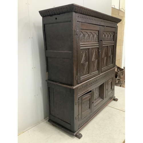 9 - A late 17th century Continental carved oak two section cupboard, width 166cm, depth 57cm, height 167... 