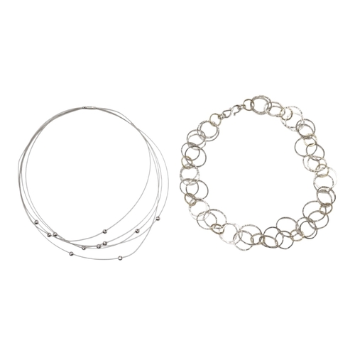 901 - A modern Pruden & Smith silver and yellow metal hoop necklace and a 750 white metal and diamond set ... 