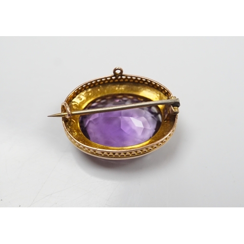 905 - A mid 20th century 9ct and single stone oval cut amethyst set pendant brooch, with seed pearl border... 