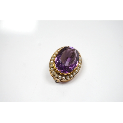 905 - A mid 20th century 9ct and single stone oval cut amethyst set pendant brooch, with seed pearl border... 