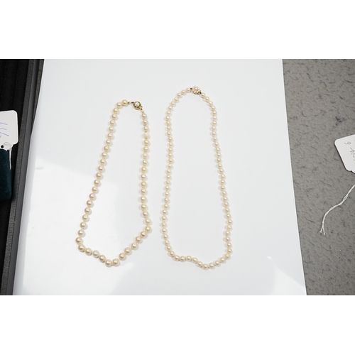 909 - Two modern single strand cultured pearl necklaces, one with cultured pearl and gem set 18ct gold cla... 