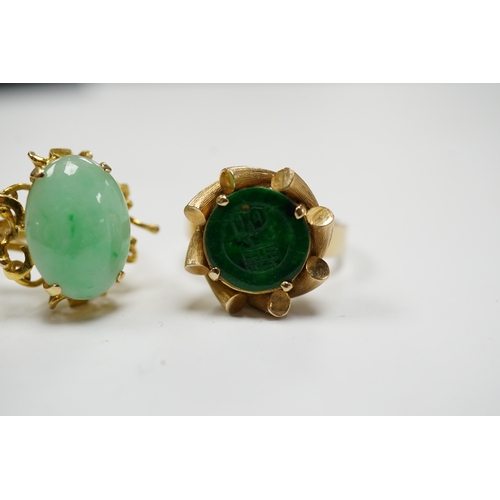 911 - A Chinese 14k and single stone oval cabochon jadeite set ring, size P and a similar 14k and spinach ... 