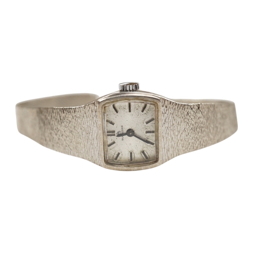 915 - A lady's modern 18k white metal Bucherer manual wind bracelet wrist watch, gross weight 26.1 grams, ... 