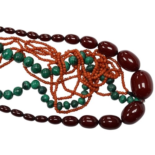 923 - A graduated simulated cherry amber bead necklace, 43cm, gross weight 54 grams and two other necklace... 