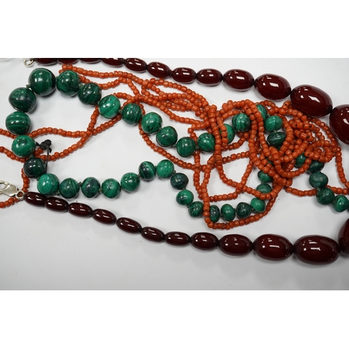 923 - A graduated simulated cherry amber bead necklace, 43cm, gross weight 54 grams and two other necklace... 