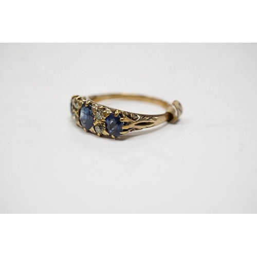 928 - A yellow metal and three stone sapphire and four stone diamond set half hoop ring, size P/Q, gross w... 