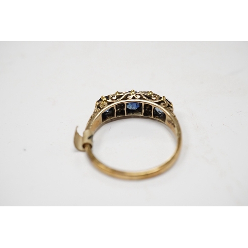 928 - A yellow metal and three stone sapphire and four stone diamond set half hoop ring, size P/Q, gross w... 