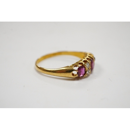 931 - A late Victorian 18ct gold and three stone ruby set half hoop ring, with four stone diamond chip spa... 