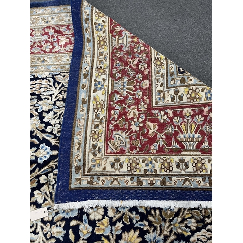 98 - A North West Persian blue ground carpet, 394 x 284cm. Condition - good