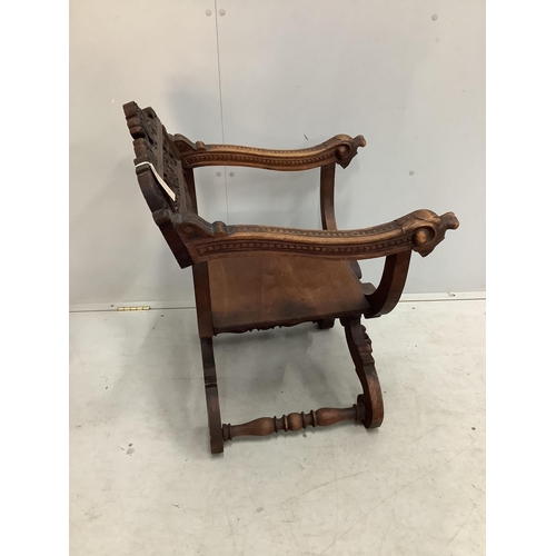 1023 - A carved 'X' framed chair, width 58cm, depth 53cm, height 79cm. Condition - fair