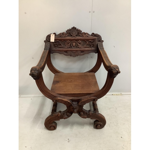 1023 - A carved 'X' framed chair, width 58cm, depth 53cm, height 79cm. Condition - fair