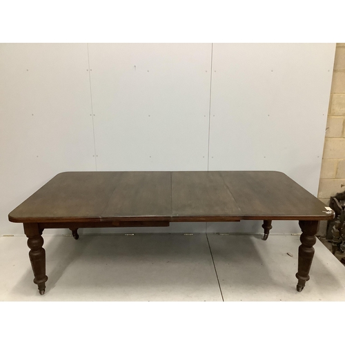 1050 - A late Victorian oak extending dining table, width 240cm extended, two spare leaves, depth 120cm, he... 