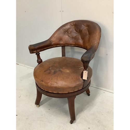 1094 - A 19th century Holland & Son leather button back office chair (missing one castor), width 65cm, dept... 