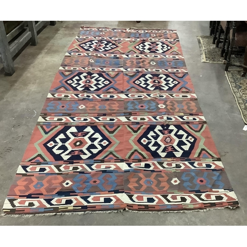 1110 - A large Kilim wall-hanging / rug 390cm x 173cm. Condition - fair