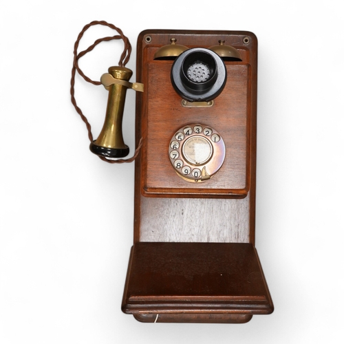 1251 - A 1920s mahogany wall mounted GPO Model 121 telephone, Patent no.178938. Condition - good.