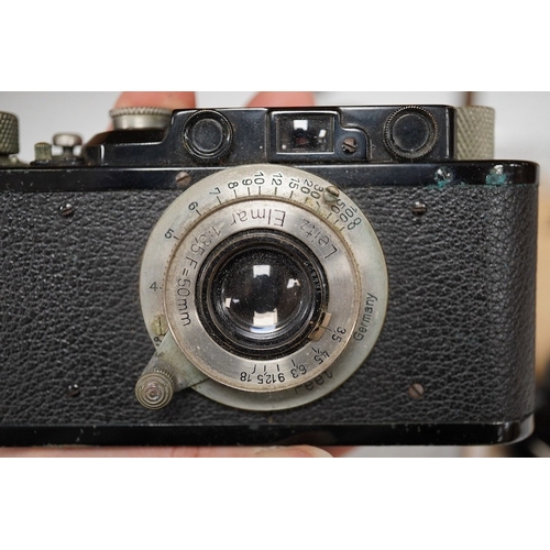 1252 - A Leica Model II camera in leather case, together with an Elmar 4.5/135mm lens, lens table booklet a... 