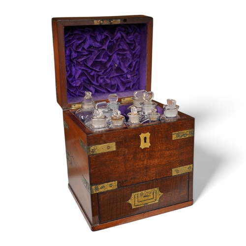 1254 - An early 19th century mahogany apothecary box, containing ten glass bottles, one with original paper... 