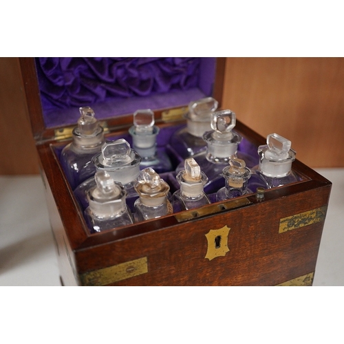 1254 - An early 19th century mahogany apothecary box, containing ten glass bottles, one with original paper... 