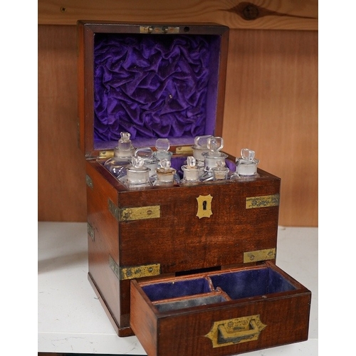 1254 - An early 19th century mahogany apothecary box, containing ten glass bottles, one with original paper... 