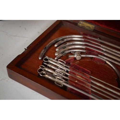 1257 - A mid 19th century mahogany cased medical set of catheter surgical instruments, inset plate to the l... 